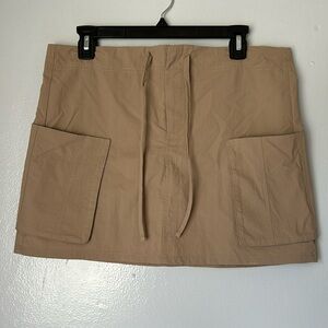Brand.- BP. Size Small, light brown color.